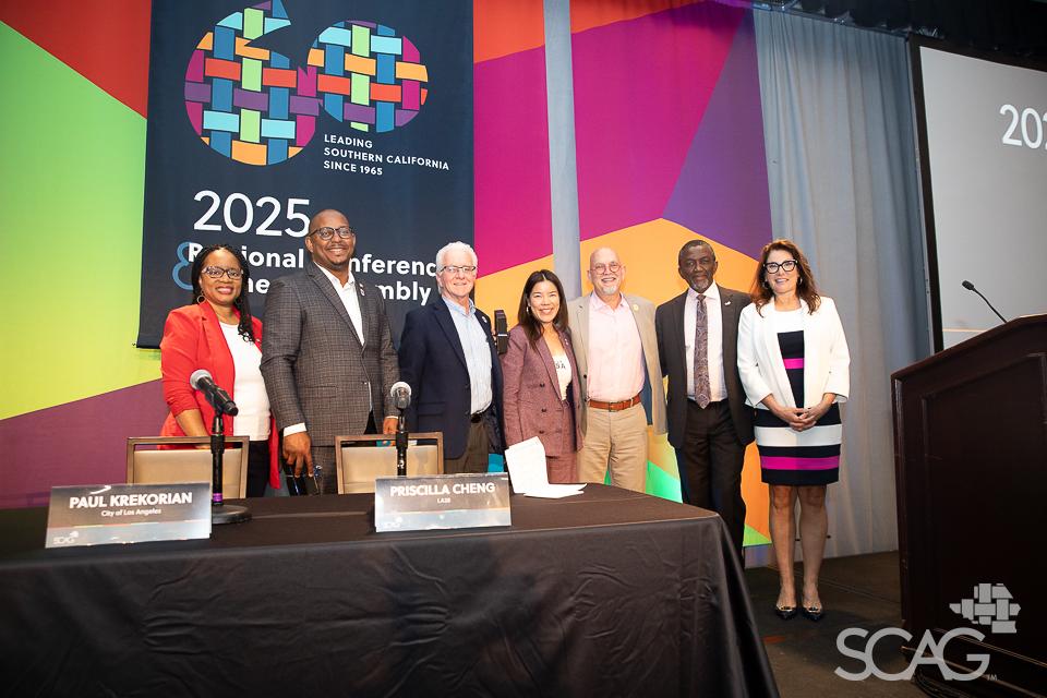 LA28 panelists on stage with SCAG Executive Director and President.