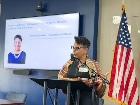 Speaker at podium with U.S.